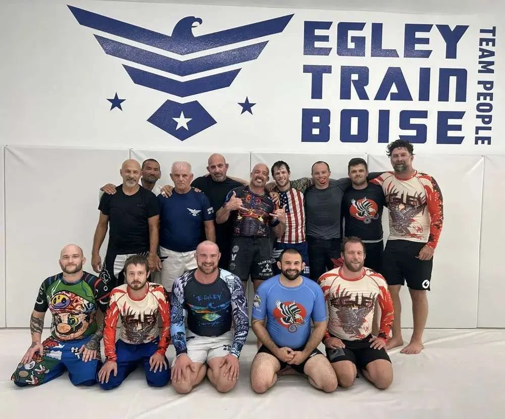 Egley Train Academy students and Coaches together under the Egley Train Boise wall