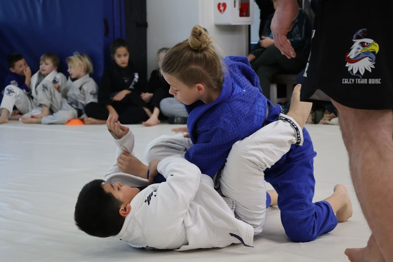 Teens engaging in martial arts training such as Brazilian Jiu-Jitsu, mixed martial arts, Tae Kwon Do, and Muay Thai, build self-defense skills, physical fitness, self-control, self-confidence, self-esteem, and mental health while practicing striking arts and kung fu, embodying the core values of discipline and respect.